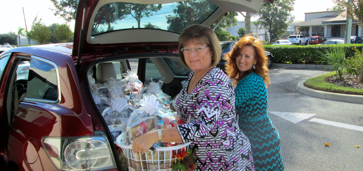 Brenda and Holly load donation baskets